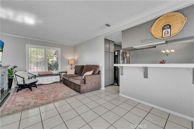 37025 96th St E, Littlerock, CA 93543 - living room with light tile patterned floors, visible vents, baseboards, ornamental molding, and a notable chandelier