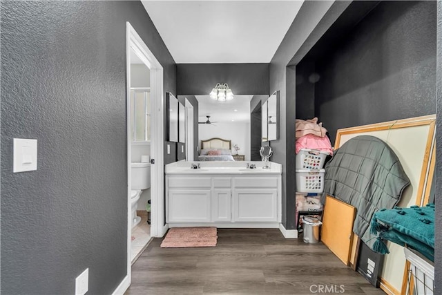 37025 96th St E, Littlerock, CA 93543 - full bathroom with wood finished floors, a textured wall, and toilet