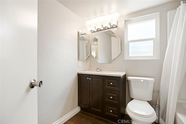 13139 Kiowa Dr, Moreno Valley, CA 92553 - bathroom featuring baseboards, toilet, vanity, wood finished floors, and curtained shower