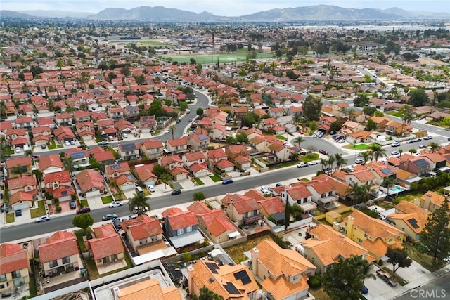 13139 Kiowa Dr, Moreno Valley, CA 92553 - aerial view of property and surrounding area featuring a mountainous background and nearby suburban area