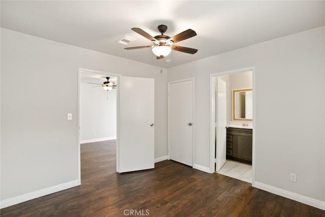 13139 Kiowa Dr, Moreno Valley, CA 92553 - unfurnished bedroom with baseboards, wood finished floors, ensuite bathroom, and a ceiling fan