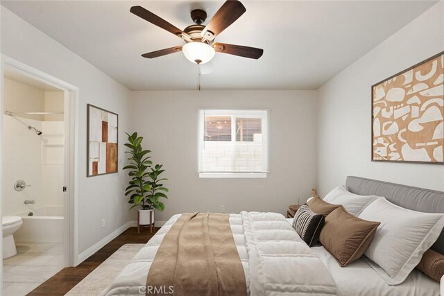 13139 Kiowa Dr, Moreno Valley, CA 92553 - bedroom with connected bathroom, wood finished floors, baseboards, and ceiling fan