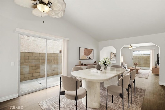 13139 Kiowa Dr, Moreno Valley, CA 92553 - dining room with ceiling fan, vaulted ceiling, light wood finished floors, arched walkways, and baseboards