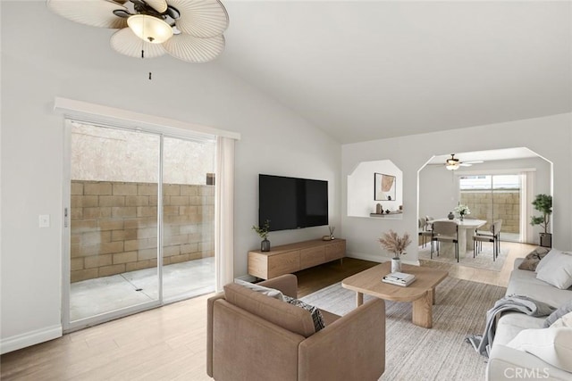 13139 Kiowa Dr, Moreno Valley, CA 92553 - living area featuring a ceiling fan, vaulted ceiling, baseboards, and light wood-style floors