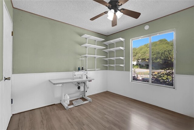 649 Sycamore Ave, Claremont, CA 91711 - spare room featuring a textured ceiling, wood finished floors, a wainscoted wall, and ceiling fan