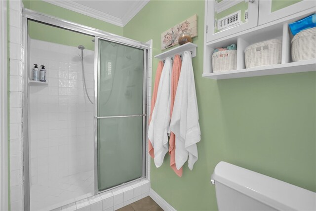 649 Sycamore Ave, Claremont, CA 91711 - full bath with a shower stall, toilet, crown molding, tile patterned flooring, and baseboards