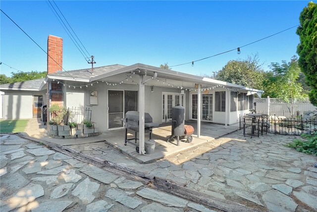 649 Sycamore Ave, Claremont, CA 91711 - back of house featuring a patio area, fence, a chimney, stucco siding, and a sunroom