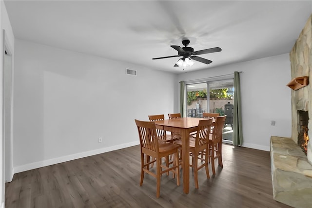 649 Sycamore Ave, Claremont, CA 91711 - dining area featuring dark wood-style floors, a ceiling fan, baseboards, and a fireplace