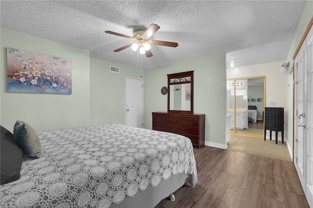 649 Sycamore Ave, Claremont, CA 91711 - bedroom with wood finished floors, a textured ceiling, a ceiling fan, and baseboards