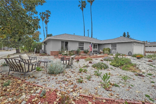 649 Sycamore Ave, Claremont, CA 91711 - back of property featuring stucco siding, a garage, a shingled roof, and cooling unit