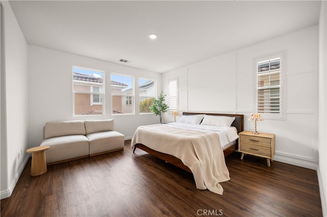 16005 Blueberry Ave, Chino, CA 91708 - bedroom featuring dark wood-style flooring, visible vents, baseboards, and multiple windows