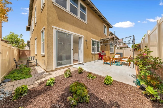 16005 Blueberry Ave, Chino, CA 91708 - rear view of property with stucco siding, a patio area, and a fenced backyard