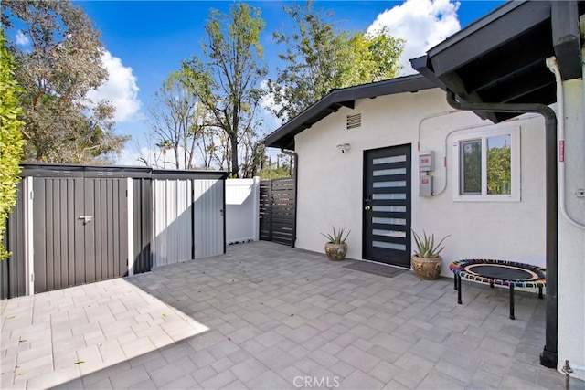 view of patio featuring fence