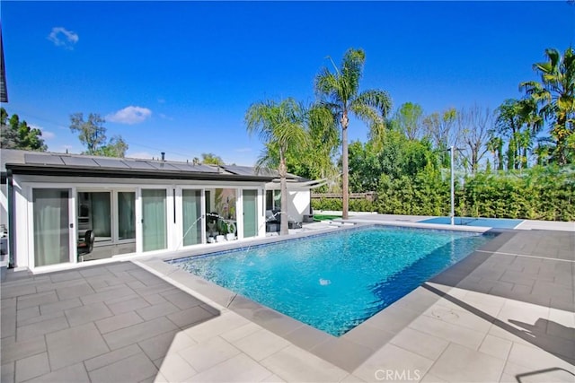 outdoor pool featuring a patio area