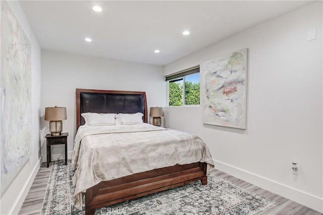 bedroom featuring baseboards, recessed lighting, and light wood-style floors