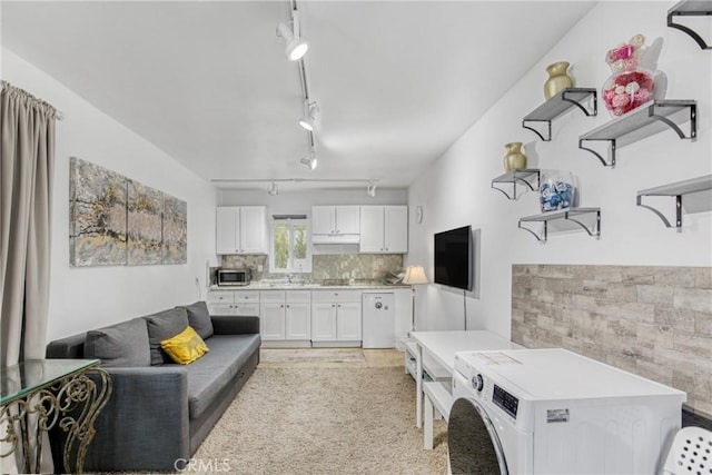 living area featuring rail lighting