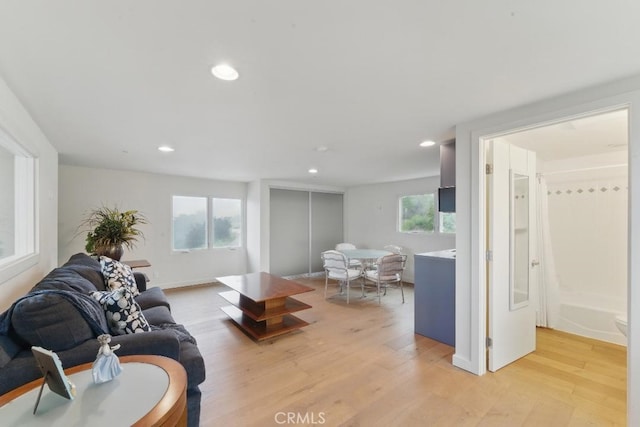 living room featuring recessed lighting and light wood-style flooring