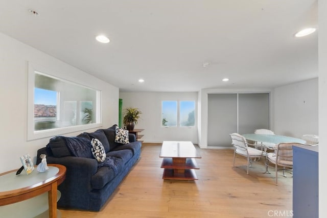 living room with recessed lighting and light wood finished floors