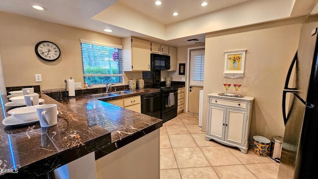 48940 Phlox Pl, Palm Desert, CA 92260 - kitchen with a peninsula, light tile patterned flooring, recessed lighting, a sink, and black appliances