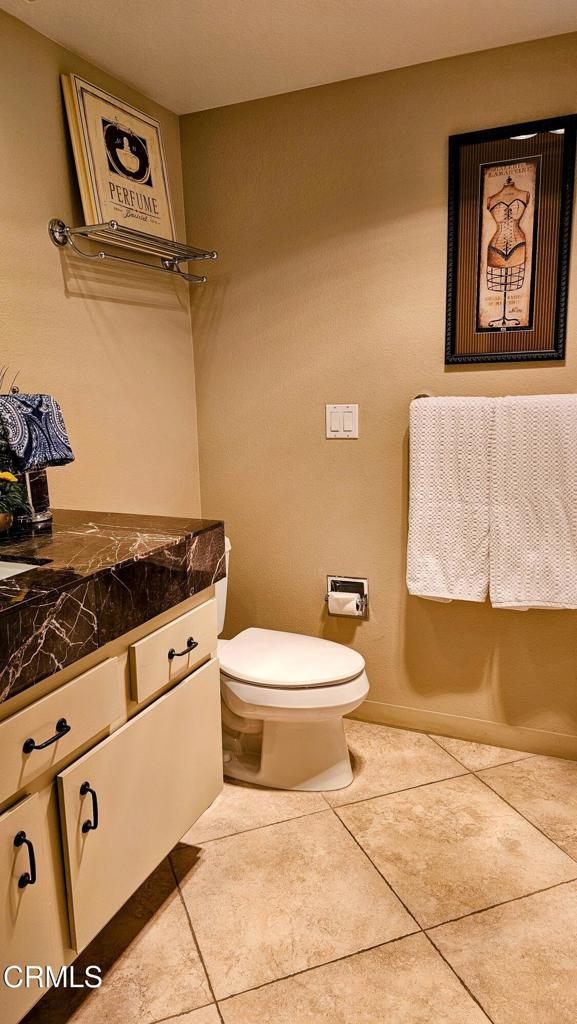 48940 Phlox Pl, Palm Desert, CA 92260 - bathroom with toilet, tile patterned flooring, and vanity