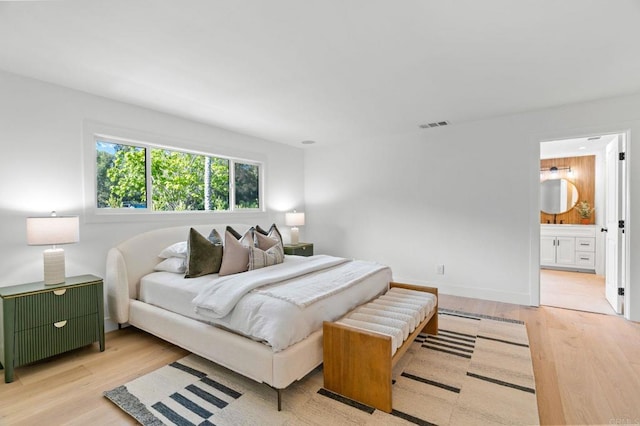 14980 Via De La Valle, Del Mar, CA 92014 - bedroom featuring visible vents, baseboards, ensuite bath, and wood finished floors