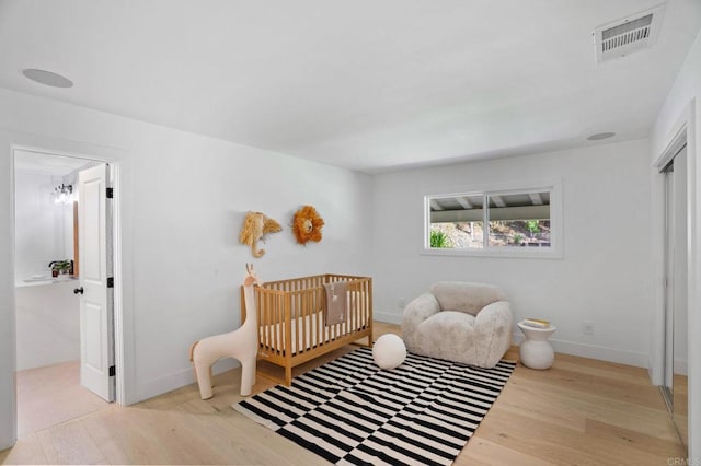 14980 Via De La Valle, Del Mar, CA 92014 - bedroom with baseboards, wood finished floors, and visible vents