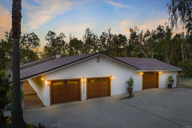14980 Via De La Valle, Del Mar, CA 92014 - view of front facade featuring stucco siding, concrete driveway, a tiled roof, and a chimney
