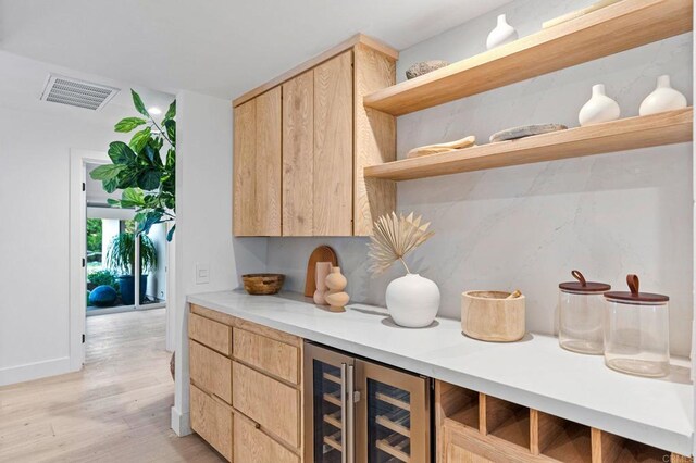 14980 Via De La Valle, Del Mar, CA 92014 - bar with beverage cooler and light wood-style flooring
