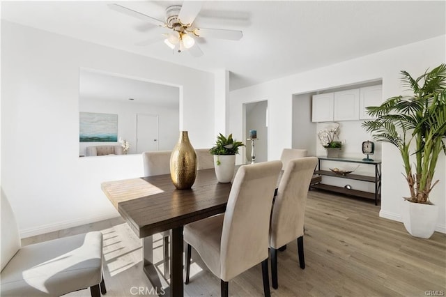 2214 W Wardlow Rd, Long Beach, CA 90810 - dining room with a ceiling fan, baseboards, and light wood-type flooring