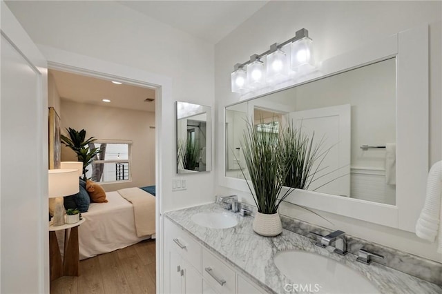 724 San Miguel Ave, Venice, CA 90291 - ensuite bathroom featuring wood finished floors, ensuite bath, double vanity, and a sink