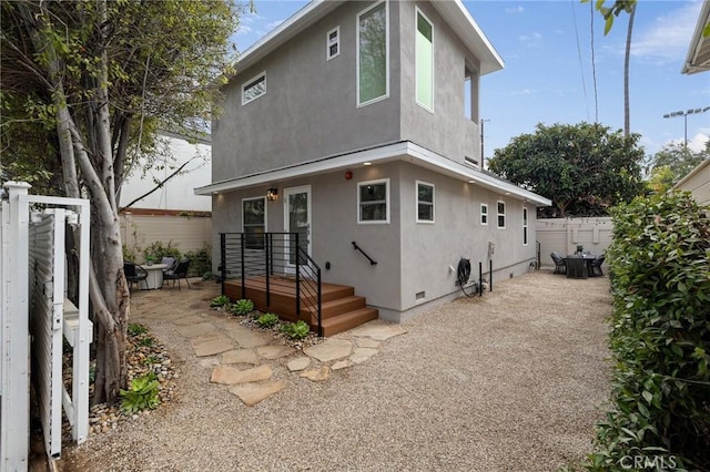 724 San Miguel Ave, Venice, CA 90291 - back of house featuring crawl space, fence, stucco siding, and a patio area