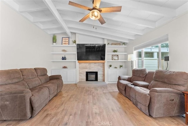 8051 Los Altos Dr, Los Molinos, CA 96055 - living area featuring lofted ceiling with beams, a fireplace, light wood-type flooring, and a ceiling fan