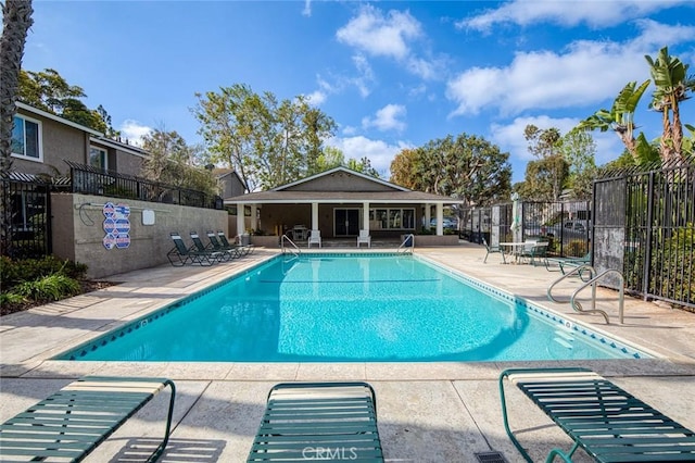 8482 Benjamin Dr Unit 10, Huntington Beach, CA 92647 - community pool with a patio area and fence