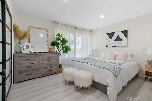 8482 Benjamin Dr Unit 10, Huntington Beach, CA 92647 - bedroom featuring light wood-type flooring, recessed lighting, and baseboards