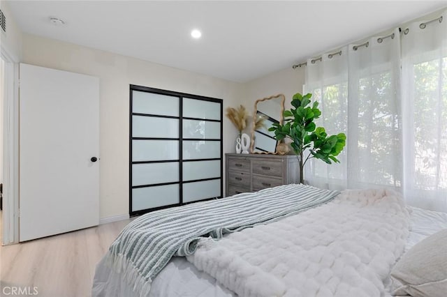 8482 Benjamin Dr Unit 10, Huntington Beach, CA 92647 - bedroom with recessed lighting, visible vents, and wood finished floors
