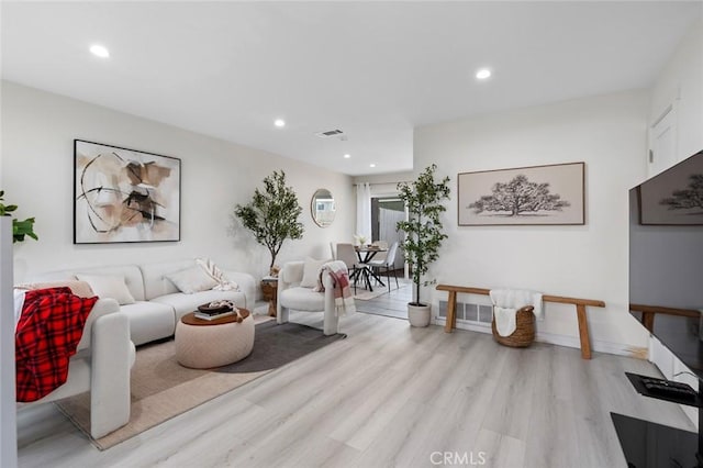 8482 Benjamin Dr Unit 10, Huntington Beach, CA 92647 - living area with recessed lighting, light wood-style flooring, and visible vents