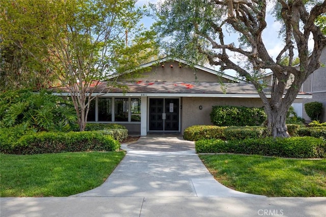 8482 Benjamin Dr Unit 10, Huntington Beach, CA 92647 - ranch-style home with french doors, stucco siding, and a front yard