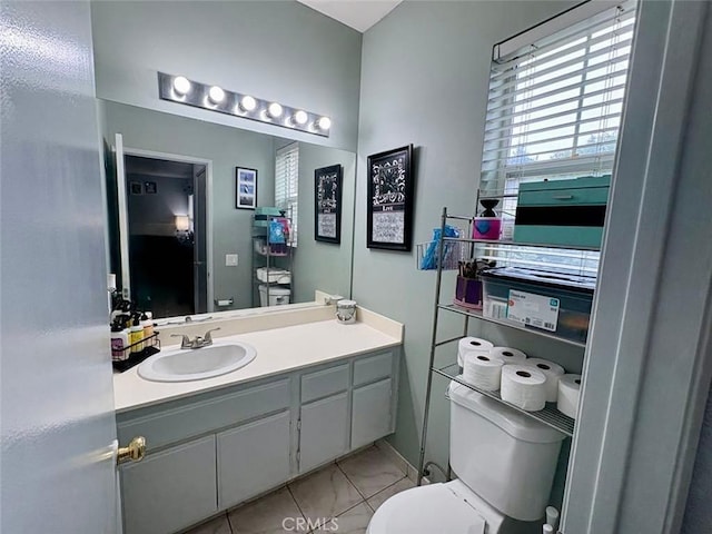 39557 Warbler Dr, Temecula, CA 92591 - bathroom featuring toilet, vanity, and marble look tile flooring