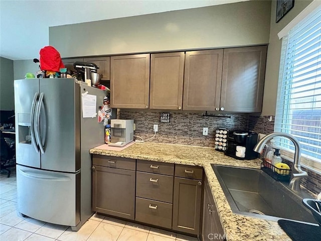 39557 Warbler Dr, Temecula, CA 92591 - kitchen featuring stainless steel fridge, a sink, tasteful backsplash, and plenty of natural light