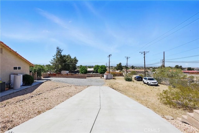 view of yard with a patio and fence