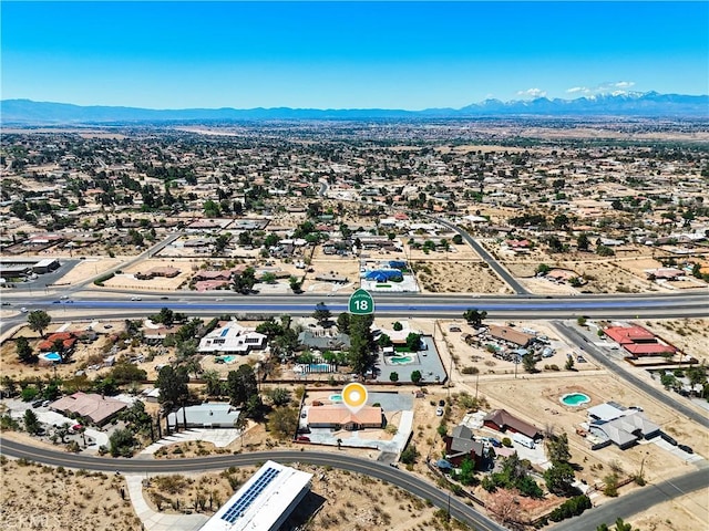 birds eye view of property featuring a mountain view