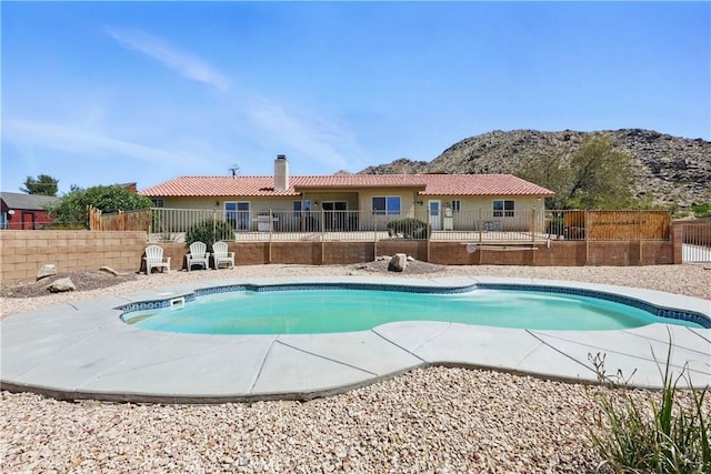 15710 Rimrock Rd, Apple Valley, CA 92307 - view of swimming pool with fence, a fenced in pool, a mountain view, and a patio area