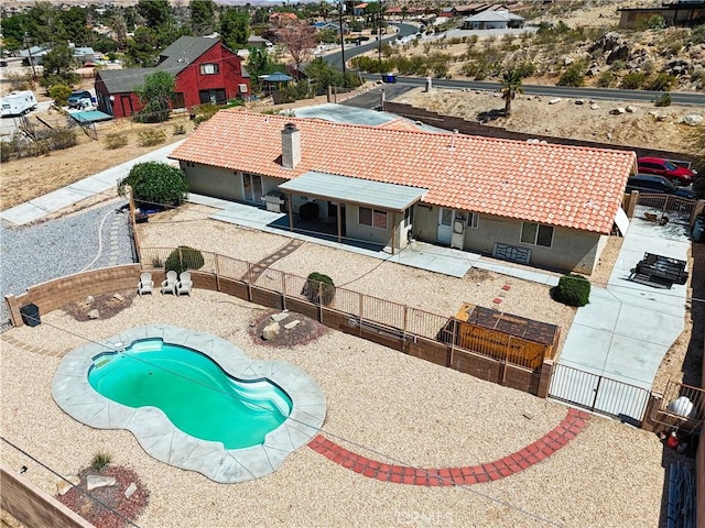 view of pool with a fenced in pool, a gate, a patio area, and a fenced backyard