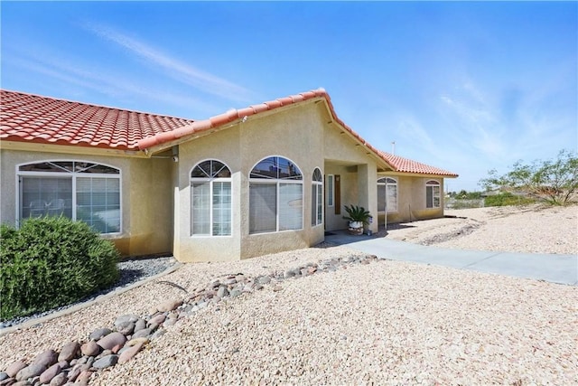 15710 Rimrock Rd, Apple Valley, CA 92307 - exterior space featuring stucco siding and a tile roof
