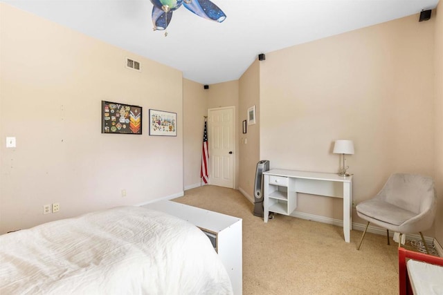 bedroom featuring baseboards, visible vents, and light colored carpet