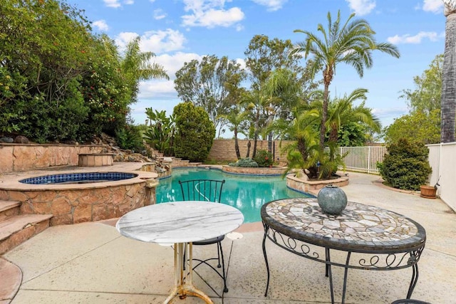 view of swimming pool featuring a fenced in pool, a patio, an in ground hot tub, and a fenced backyard