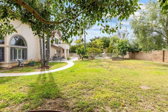 view of yard with a patio and a fenced backyard