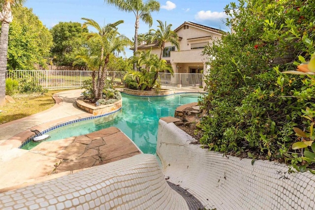 view of swimming pool with fence and a fenced in pool