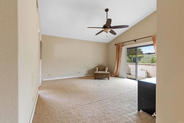unfurnished room with ceiling fan, vaulted ceiling, carpet, and baseboards