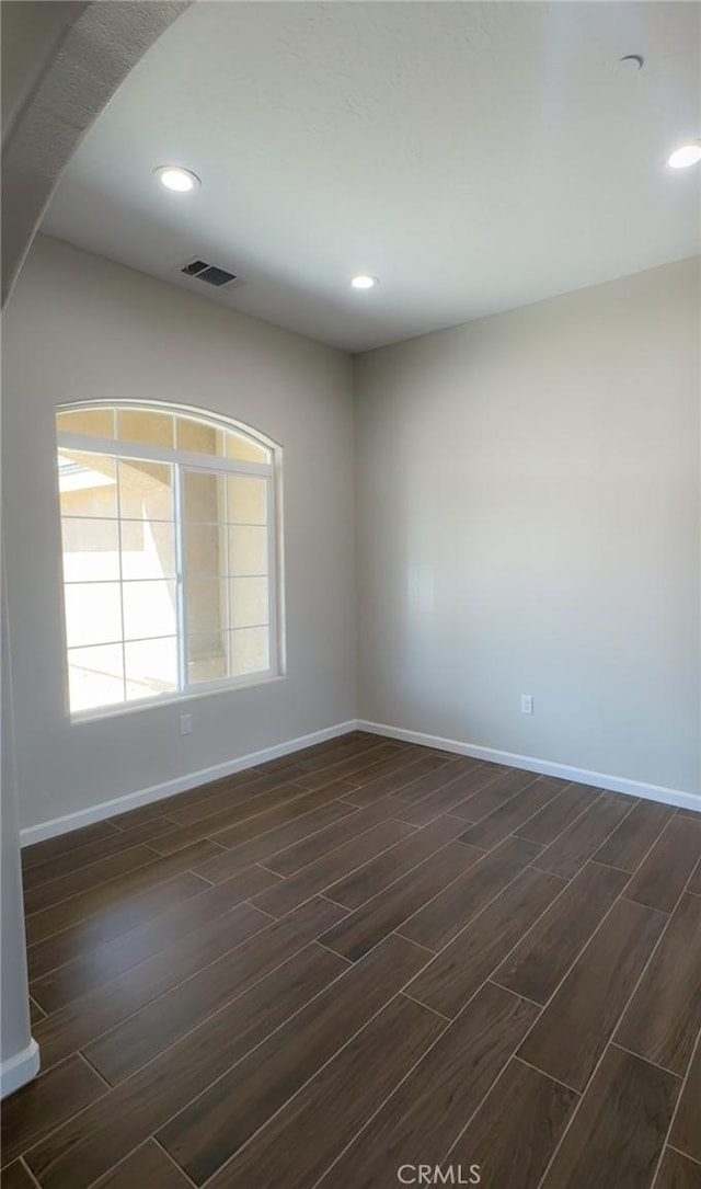 17995 Seaforth St, Hesperia, CA 92345 - empty room featuring dark wood-style flooring and recessed lighting